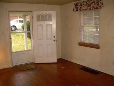 Steel front door opens into a comfortable living r