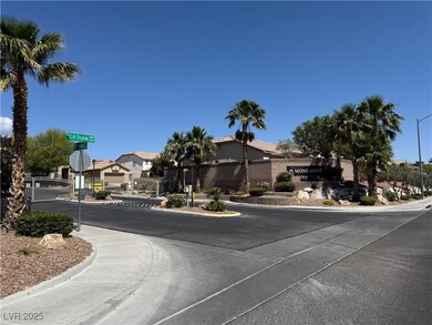 View of asphalt street featuring traffic signs, cu