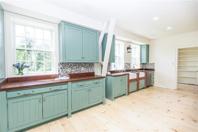 Charming kitchen with large walk-in pantry.