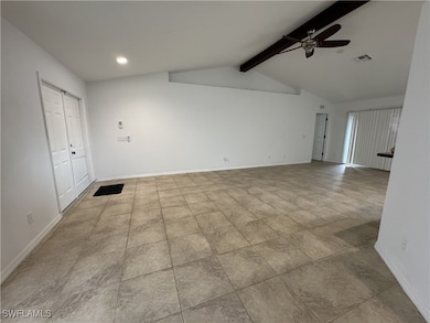 Unfurnished room with a ceiling fan, baseboards, a