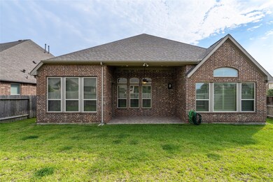 Nice size backyard with lots of windows and a cove