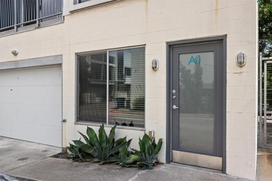 Doorway to property with an attached garage