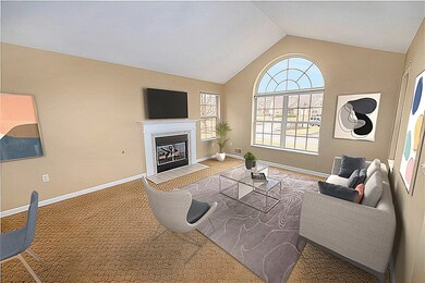 Living room with gas fireplace and plenty of natur