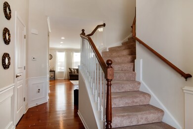 2 Story Foyer! Beautiful hardwood floors, white tr