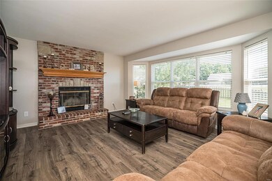 Wide plank  flooring and large bay window overlook