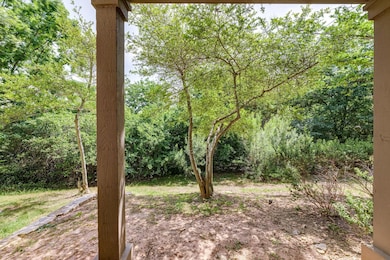View of yard featuring a forest view