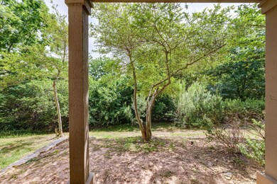 View of yard featuring a forest view