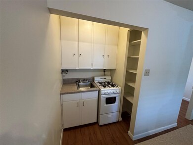 Kitchen featuring white range with gas stovetop, 