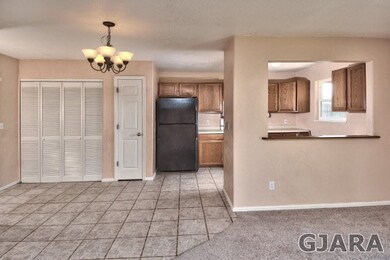 Tile flooring continues through the dining area an
