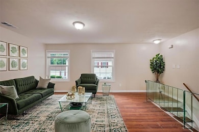 Virtual Staging Living room with wood finished floors and baseboards