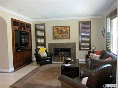 Great Room with media built-in, glass tiled firepl