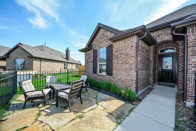 Your Courtyard with Limestone flooring!  Home has Full Gutters! Sprinkler System and more!  Let's go inside!