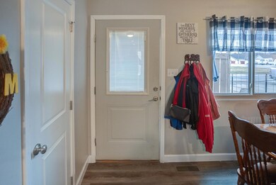 Entering through the front door into the kitchen/d