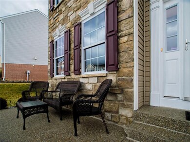Aggregate front porch and stairs provide an great 
