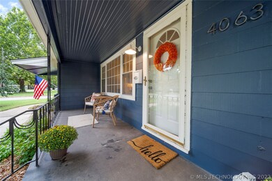 Beautiful covered front porch welcomes guests in s