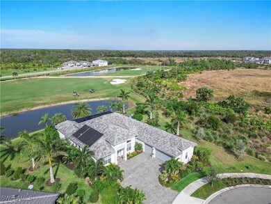 Aerial view with view of golf course and a water v