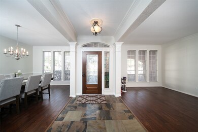 The formal living and dining rooms sit to either s