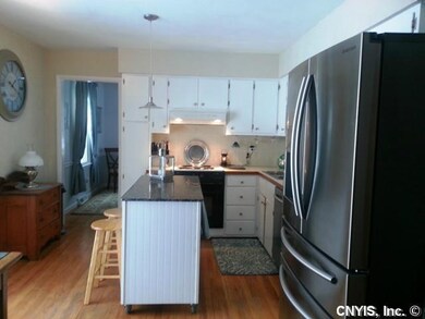 Kitchen. The kitchen features a granite topped isl