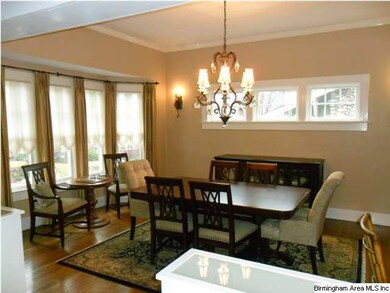 Formal dining room with bay window and so much nat