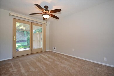 Doors from the dining room to the patio w/ pergola