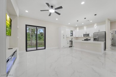 Unfurnished living room featuring light marble fin