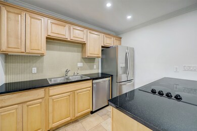 Alternate view of the kitchen space and sleek stai