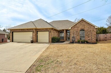 Ranch-style house with a front lawn and a garage