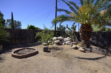 Backyard has great areas for gardening.