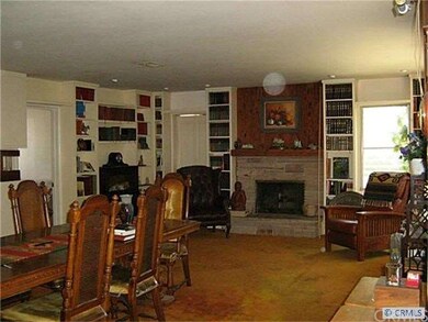 Large family room with cozy elegant fireplace