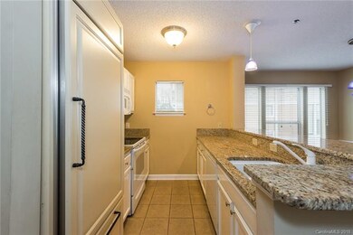 Updated Kitchen with Sub Zero Fridge and granite countertops.