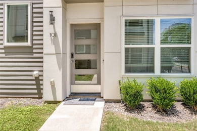 Doorway to property with stucco siding