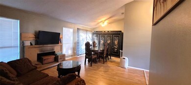 Spacious living area with attached dining space.