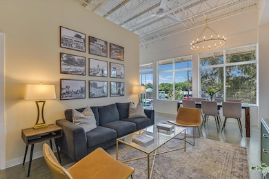Living area with baseboards, a chandelier, a high