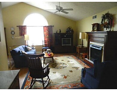 Living Room. Cathedral ceiling and fan along with 