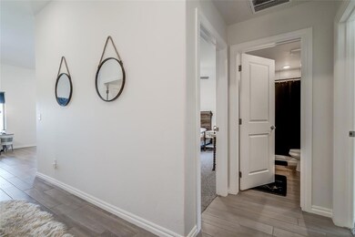 Hallway featuring light hardwood / wood-style floo