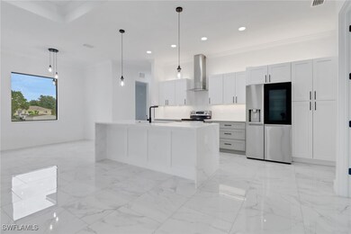 Kitchen with appliances with stainless steel finis