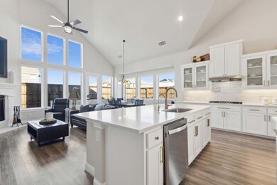 Kitchen featuring oversized seated island with sin