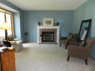 The 14x13 Living Room with a wood-burning fireplac