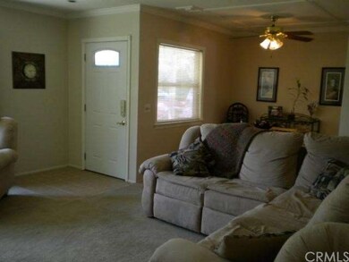 Tiled entry, carpet over wood flooring