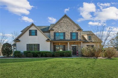 View of front of house featuring brick siding and 