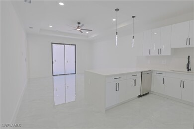 Kitchen with marble finish floor, dishwasher, a si