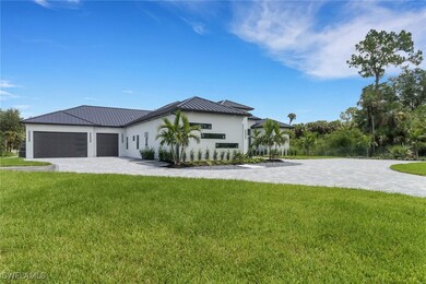 Side of the home that features a three car garage