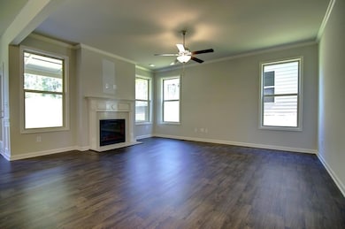 Unfurnished living room with dark hardwood / wood-