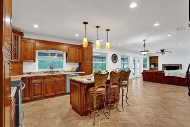 Updated kitchen with wood cabinets, granite counte
