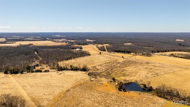 Overview of rural landscape featuring a nearby body of water