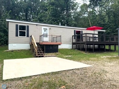 Front View with Concrete Parking Slab & 2 Decks