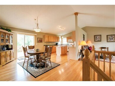 Hardwood floors throughout the open living area, l