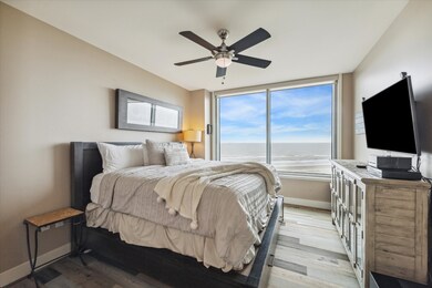 The primary bedroom boasts a large picture window