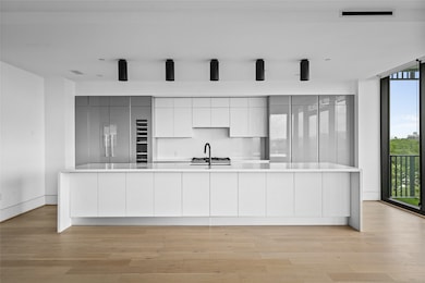 The generous kitchen island enhances the space wit