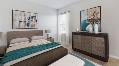 Carpeted bedroom with baseboards